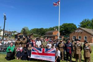 Raising the Armed Forces Day flag at Sandhurst